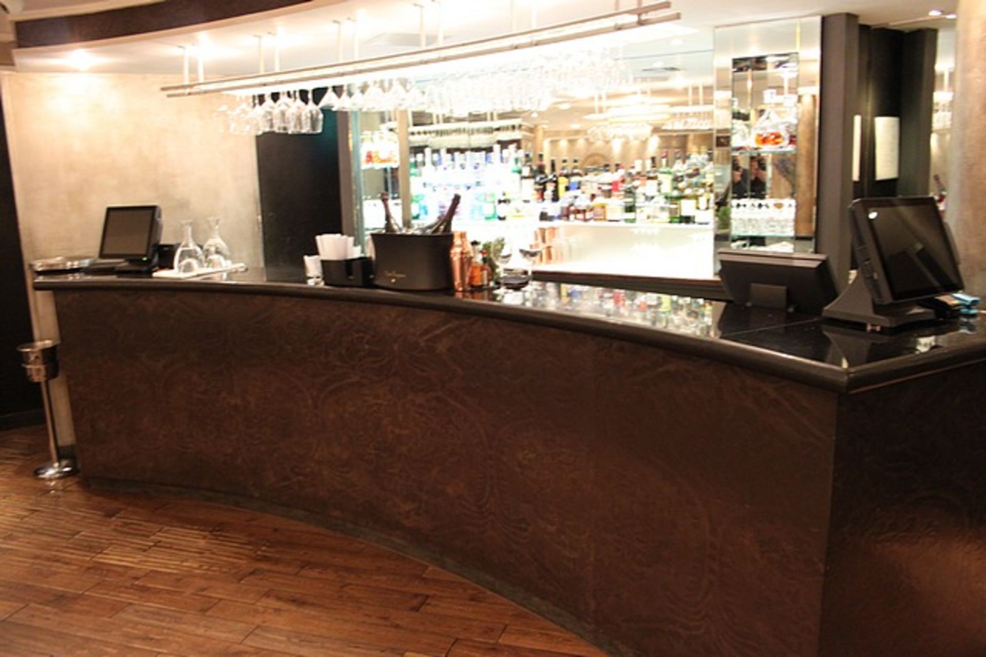 Complete bar counter comprising of a dark wood copper effect laminated front bar with honed marble