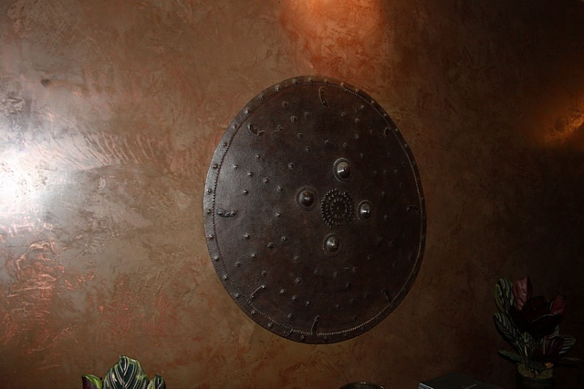 Metal wall art in the form of a shield 700mm diameter