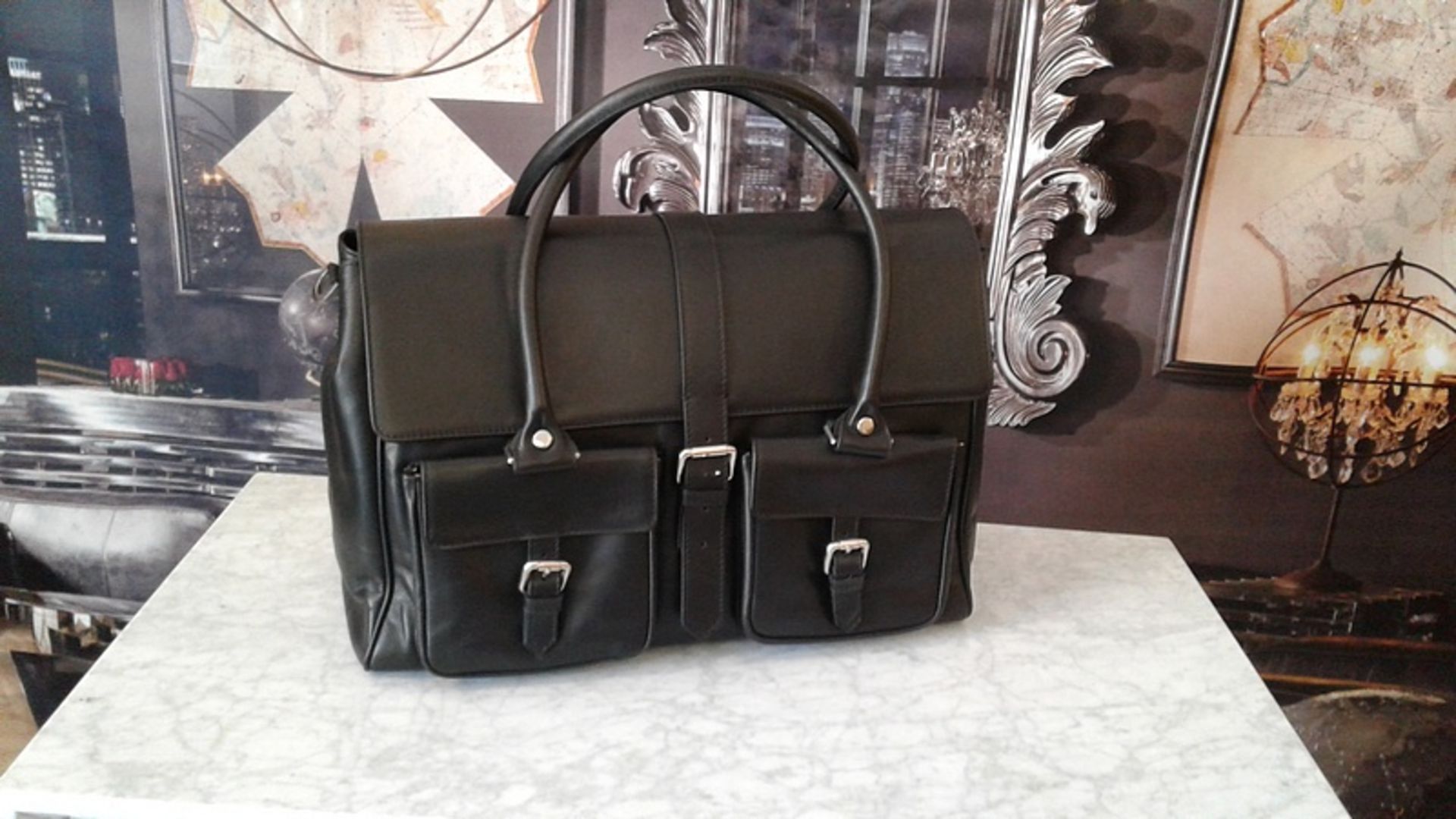 The Milano black leather buckle satchel bag is made for the person on the go. Handcrafted from