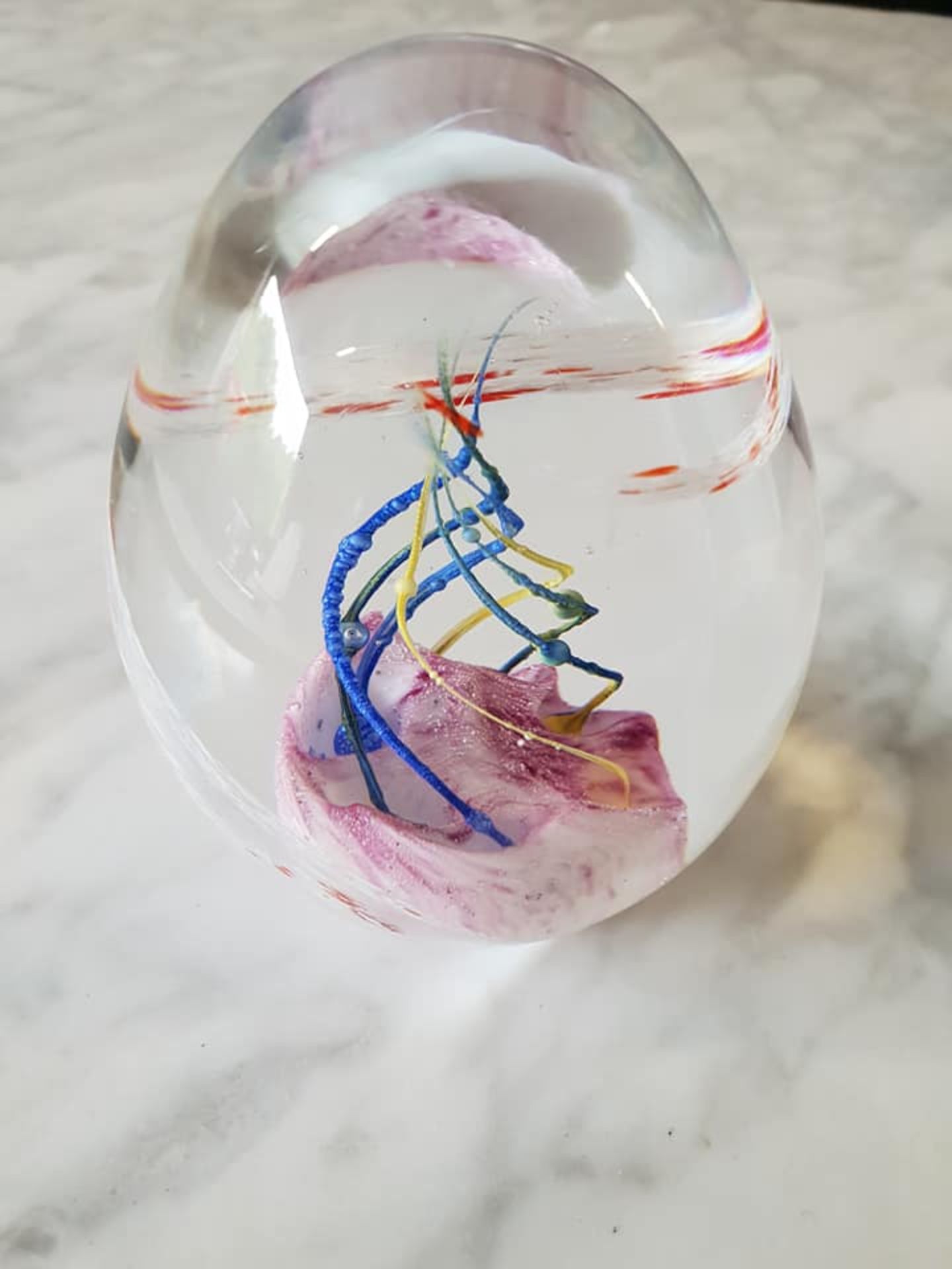Bohemian blown art glass ovoid paperweight 9cm swirls of pink and white with blue and yellow bands