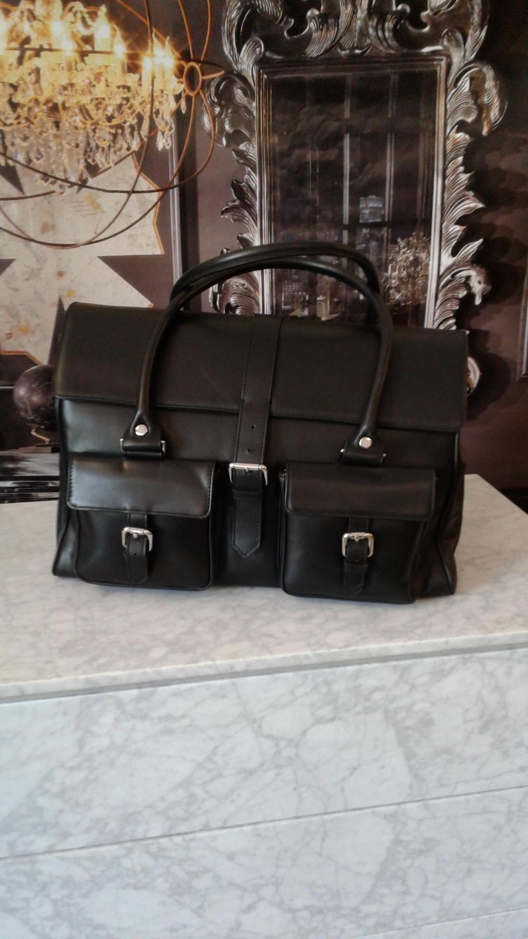 Milano Satchel The Milano black leather buckle satchel bag is made for the person on the go.