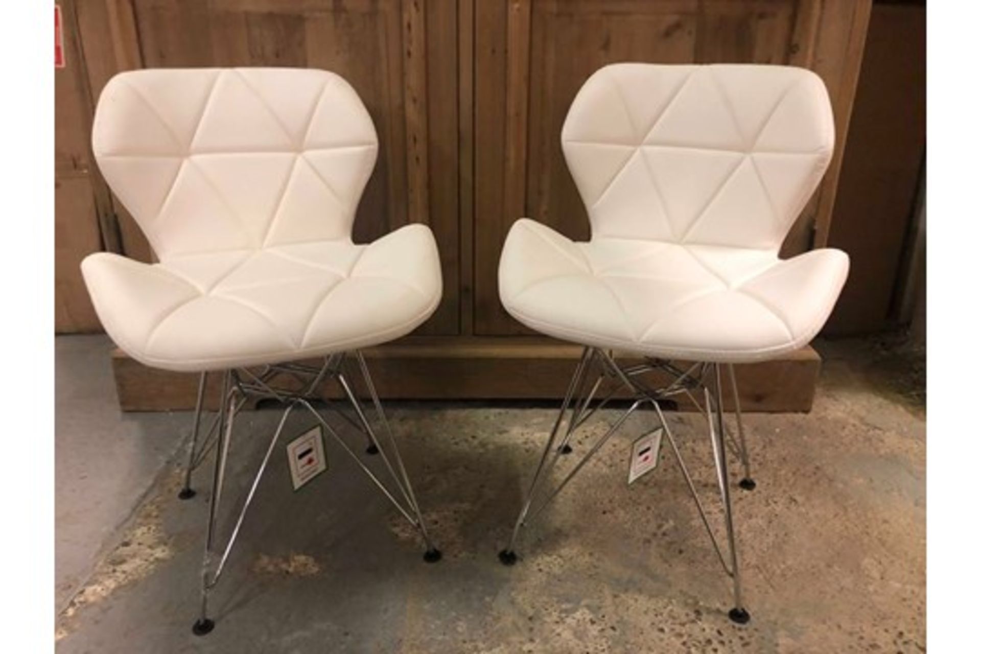 A Pair Of Charles Jacobs Chairs White With Metal Legs The Chair Provides A Crisp, Clean Look To