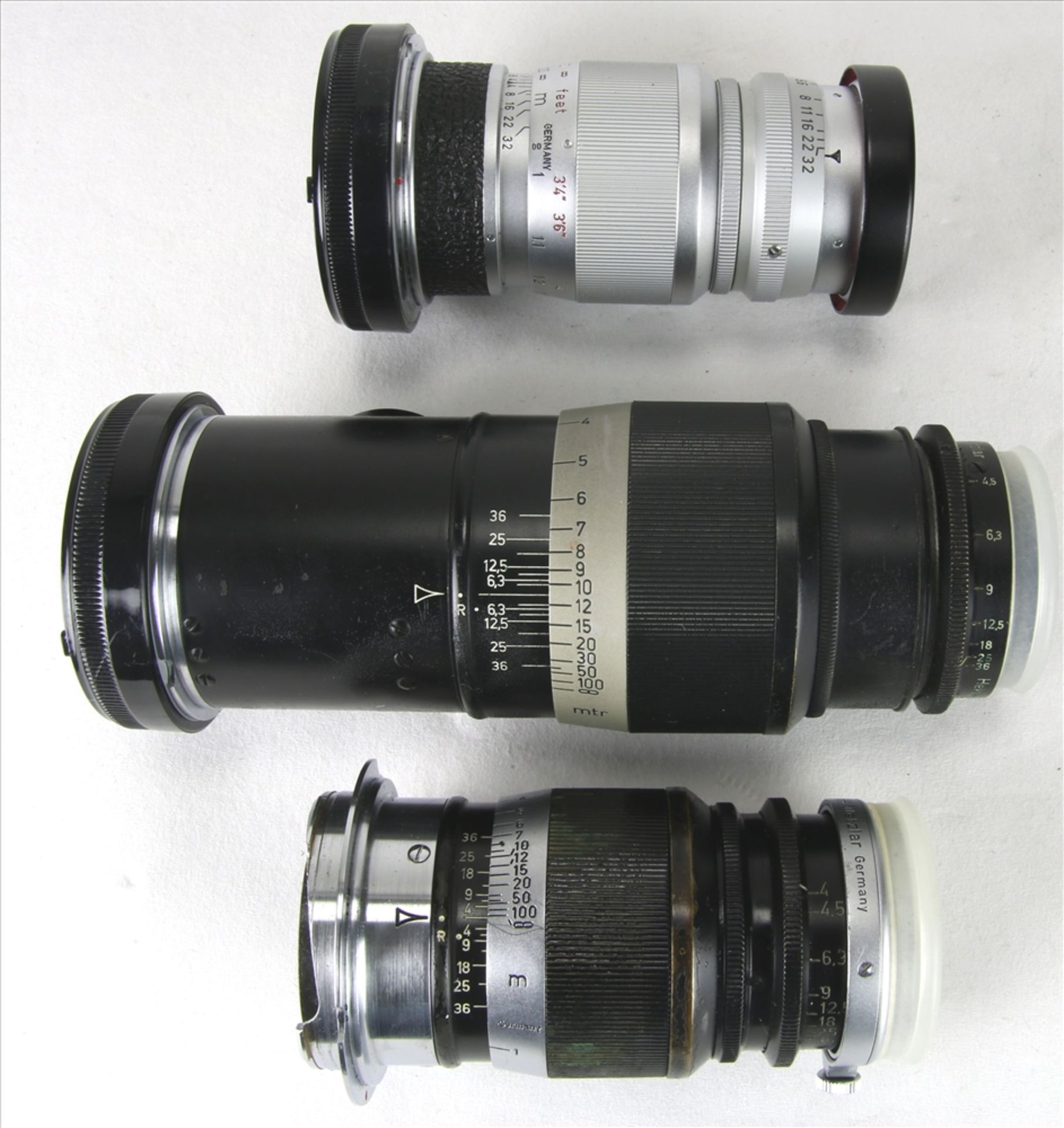 Drei Objektive für Leica Elmar f=9 cm, 1:4 und Elmar 1:4 / 90 sowie ein Hektor f=13,5 cm / 1:4,5. - Bild 4 aus 4