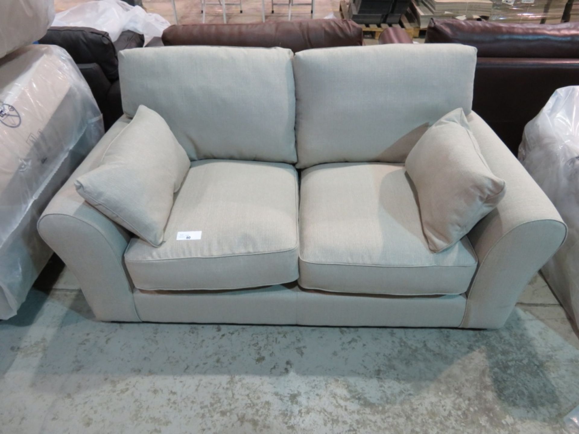 2 Seater beige sofa. Ex Display - 1770 x 960mm (LxD)