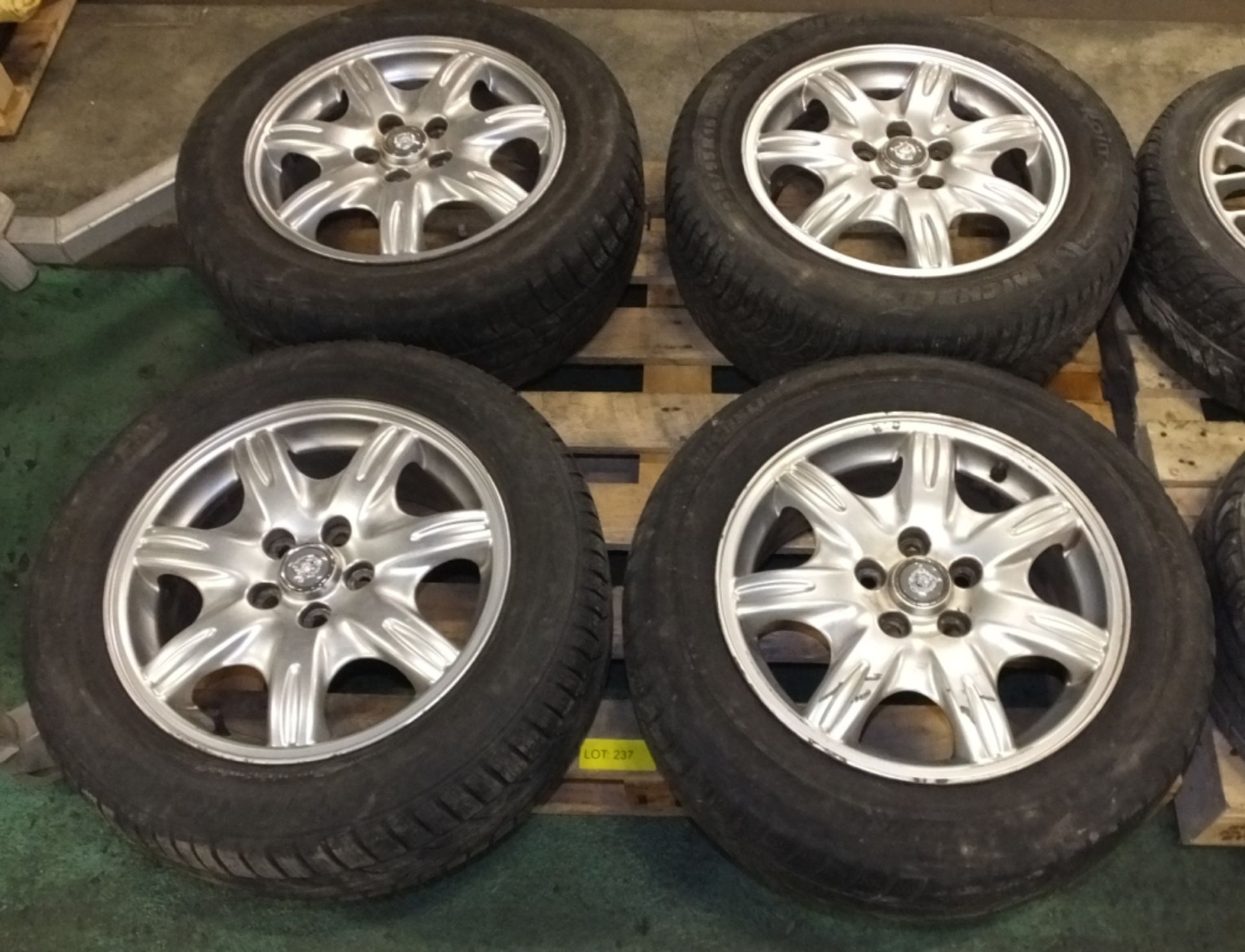 4 Jaguar 225/55 R16 alloy wheels with Jaguar centre caps - Please note there will be a loa