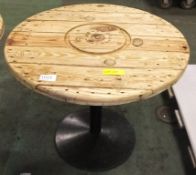 Round topped wooden garden table