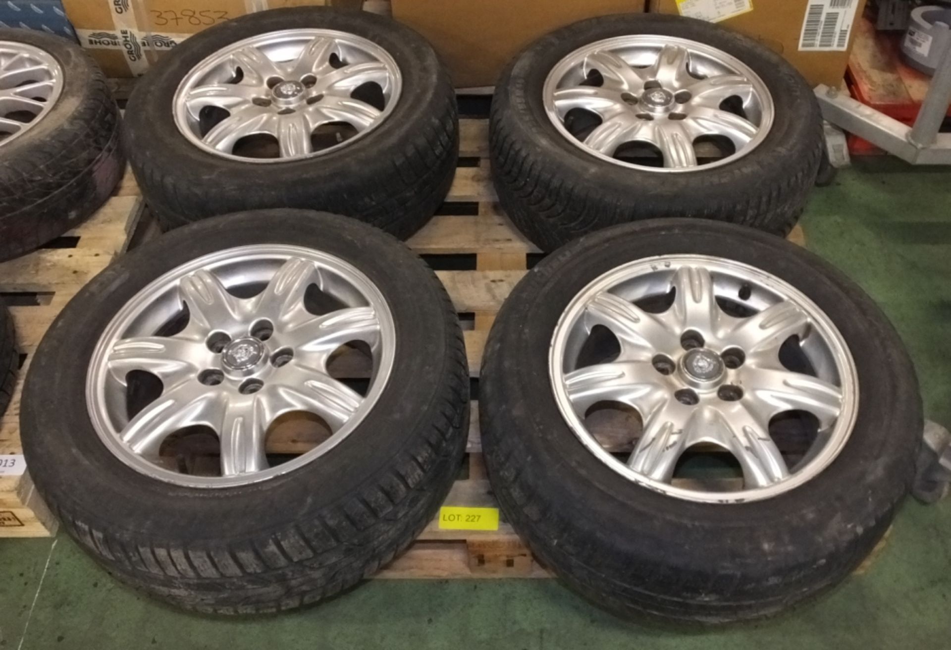 4 Jaguar 225/55 R16 alloy wheels with Jaguar centre caps - Please note there will be a loa
