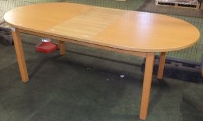 Wooden extendable dining table