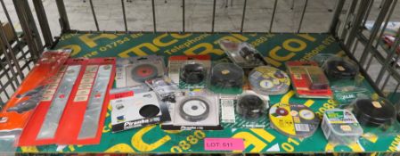 Qty of assorted sanding discs, lawnmower blades, strimmer spares, etc