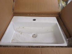 2x Various white porcelain sinks.