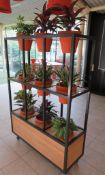 MOBILE THREE TIER FLORAL DISPLAY STAND C/W TERRACOTTA POTTED ARTIFICIAL PLANTS