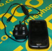 Samsung W GT-I8150 phone with charger