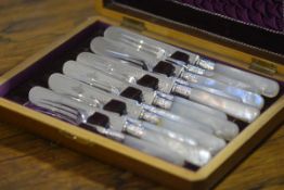 A Victorian cased set of six mother of pearl handled, silver-plated fruit knives and forks, the