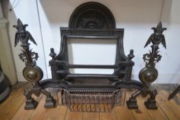 A cast-iron fire basket, with arched top foliate-cast fireback above a basket topped with a pair