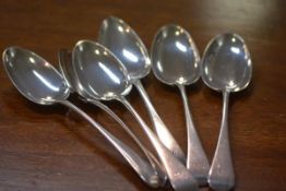 A matched set of six 19th century table spoons, Old English pattern comprising: a set of four,