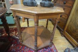 An Arts & Crafts oak centre table, in the manner of Robert Lorimer, the octagonal top raised on