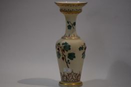 A late Victorian opaline glass vase, of baluster form with boldly flared rim, painted with vine
