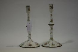 A pair of George III South Staffordshire enamel candlesticks, c. 1770, each of knopped baluster form