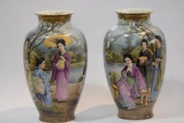 An unusual pair of Japanese porcelain vases, c. 1920/30, each painted with ladies under flowering
