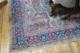 A Tabriz rug, the central foliate medallion enclosed within trailing floral spray and palmettes