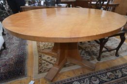 An unusual Robert "Mouseman" Thompson 4'6" circular dining table, c. 1970, the adzed top raised on a