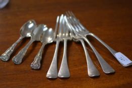 A group of 19th century silver flatware comprising: a set of five dinner forks, Hanoverian