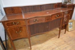 A George III inlaid mahogany sideboard, the serpentine superstructure fitted with a pair of