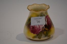 A Royal Worcester porcelain vase, painted with roses beneath a frilly rim, signed M Hunt, printed