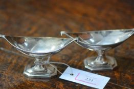 A pair of Victorian silver navette salts, Thomas Bradbury & Sons, London 1883 and 1886, in the