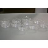 A set of ten Edwardian etched glass finger bowls, each decorated with stylised floral swags.