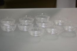 A set of ten Edwardian etched glass finger bowls, each decorated with stylised floral swags.