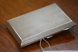 A George V substantial silver cigarette case, Chester 1926, with engine-turned decoration,