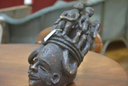 A Nigerian ceremonial carved wooden mask, with figural headdress. 51cm