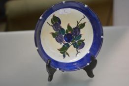 Elizabeth Amour for Bough Pottery, a fruit bowl, painted with plums, painted and printed marks,