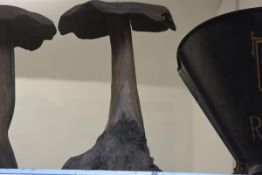 A carved wooden mushroom garden ornament. Height approx. 55cm