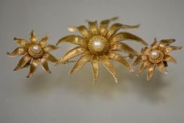 A vintage Boucher pearl bead and gilt metal suite of brooch and pair of earrings, floriform, the