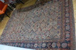 A small Caucasian carpet, the centre panel with all over lattice and floral design, enclosed