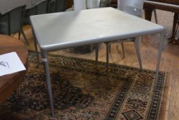 A Philippe Starck Flat Egg dining table, with silvered aluminium frame and tempered glass top. 120cm