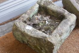 A small square weathered garden sandstone trough. c. 34cm square