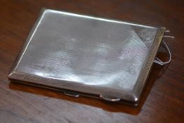 A George V silver cigarette case, Chester 1927, of rectangular form, with engine-turned