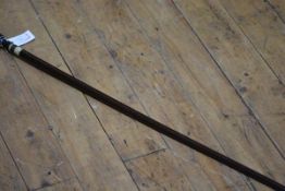 A dagger blade swordstick, the handle inset with a 1902 penny, the screw fitting with bone