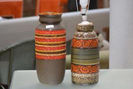 A large 1970's West German pottery vase, glazed in brown and orange; together with a West German