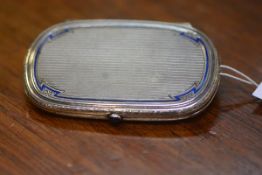 A Continental 935 standard silver and enamel lady's cigarette case, c. 1930, oval, the engine-turned
