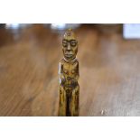 A carved slit figure of Oceanic type, late 19th/early 20th century 15cm