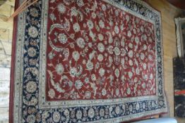 A Chinese washed wool small carpet of Persian design, the centre with all over leaf and floral