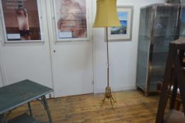 A W.A.S. Benson Edwardian copper and brass floor lamp, the fluted standard on four splayed legs