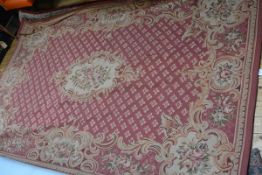 A modern Aubusson style needlework small carpet, worked with roses, flowerheads and scrolls