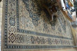 A Louis de Poortere Mossoul hand finished carpet, the triple medallion centre with a trellis and