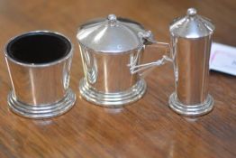 A cased three piece silver condiment set, Birmingham 1964, each piece of simple tapering cylindrical