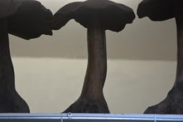 A carved wooden mushroom garden ornament. Height c. 55cm